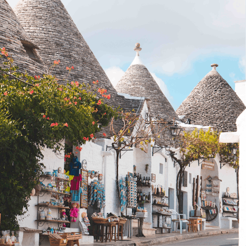 Explore the historic town of Alberobello, a ten-minute drive away