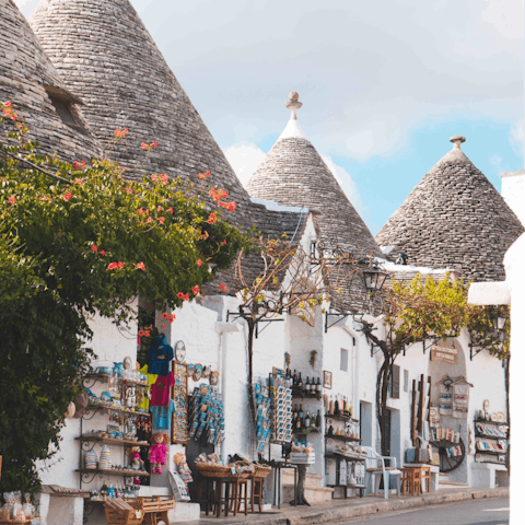 Explore the historic town of Alberobello, a ten-minute drive away