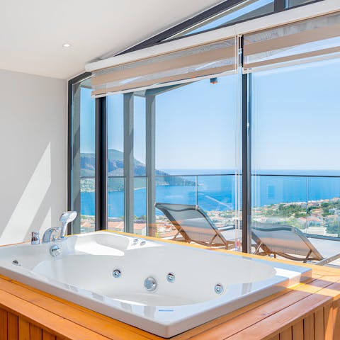 Soak in the Jacuzzi while admiring the beautiful views