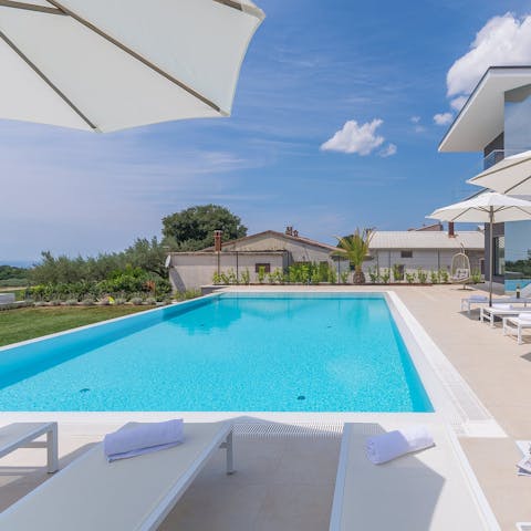 Sip cocktails and cool off by the private pool