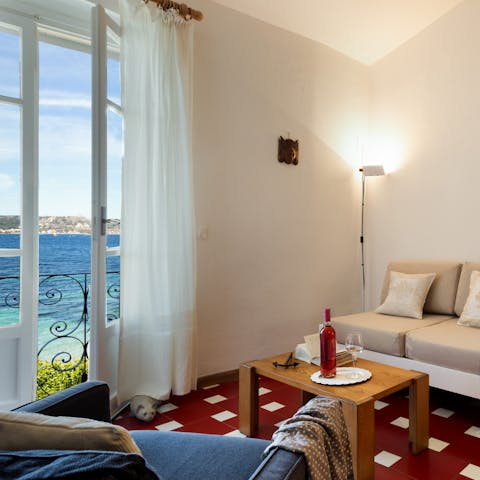 Enjoy a glass of wine while taking in the sea views