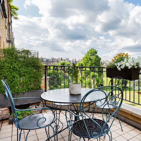 Enjoy your morning coffee on the private balcony while overlooking the beautiful residential garden