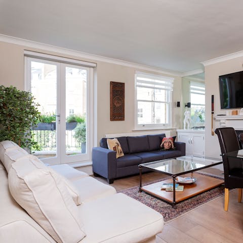 Kick back in the bright living room with a glass of wine after a day of London sightseeing