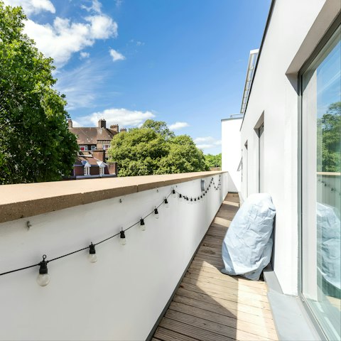 Step out onto the balcony between trips into the city