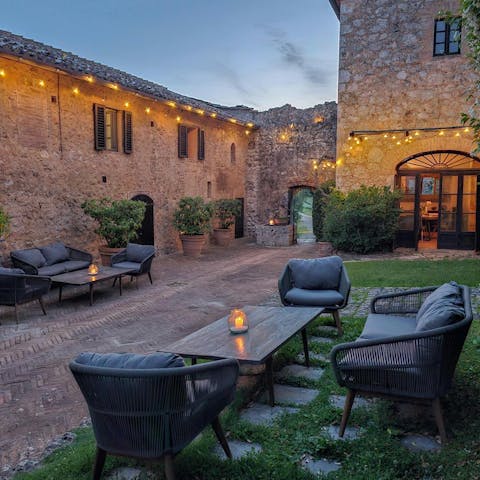 Sip pre-dinner cocktails in the medieval courtyard