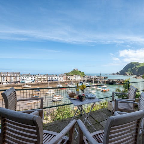 Share a bottle of sparkling, overlooking the boats in the harbour