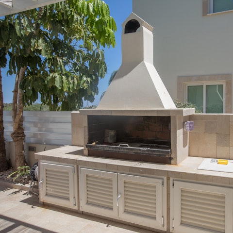Fire up the built-in barbecue for long alfresco evenings