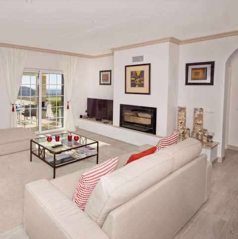 Cosy up by the fireplace and share stories about your day