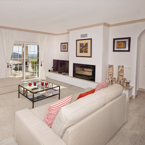 Cosy up by the fireplace and share stories about your day