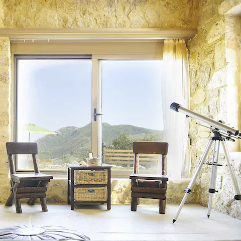 Gaze up at the night's sky with the included telescope