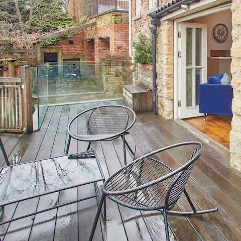 Relax on the private deck (in better weather than we had the day we visited!)