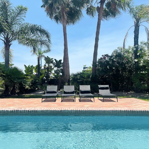 Spend sunny afternoons lounging by the private swimming pool