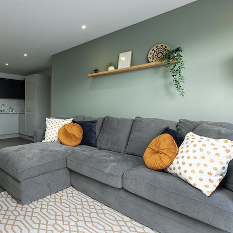 Get comfy among the plush cushions on the L-shaped couch during downtimes in your itinerary