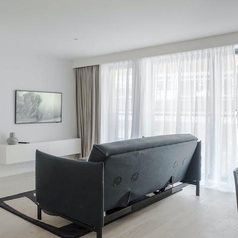 Bask in the sunlight streaming in through floor-to-ceiling windows