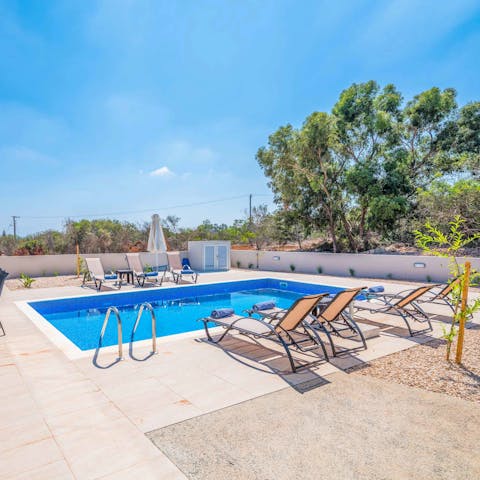 Start the day with an invigorating dip in the villa's swimming pool