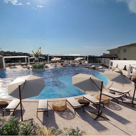 Top up your tan before diving into the shared pool to keep cool