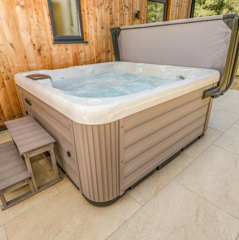Relax in the hot tub with a glass of cider