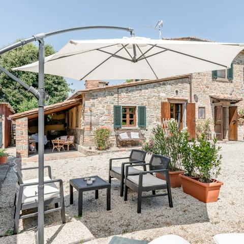 Sip cool drinks under the parasol in the garden