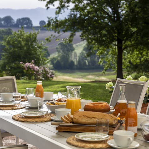 Enjoy sweeping views of the Schifanoia Valley while dining alfresco