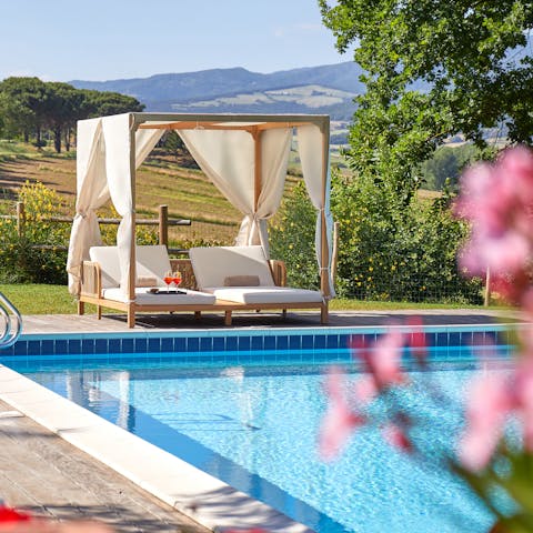 Soak up the sun beside the private pool