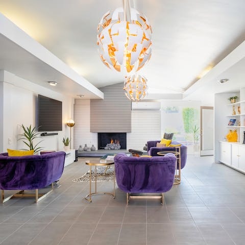 Light the fire in the stylish living room on cooler evenings in the desert