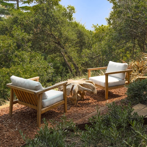 Take a relaxing moment in nature at the hillside lounge area