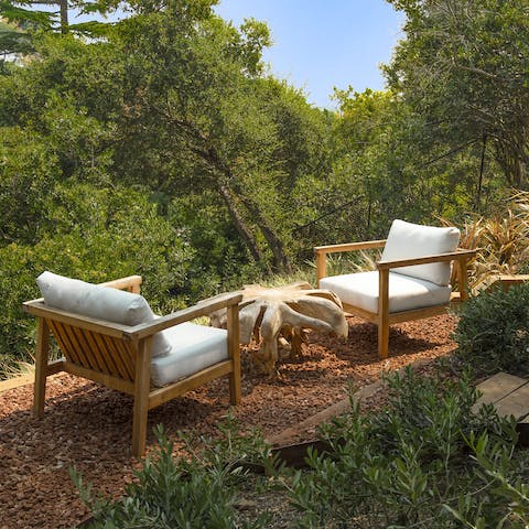 Take a relaxing moment in nature at the hillside lounge area