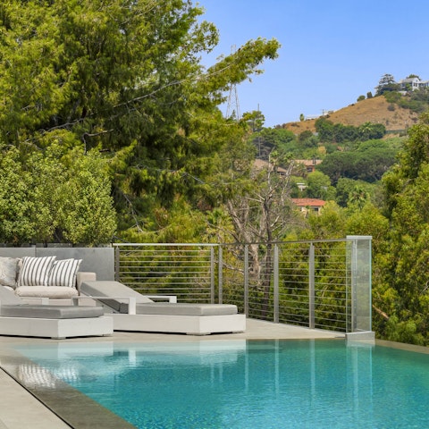 Swim laps in the pool as Runyan Canyon stretches before you