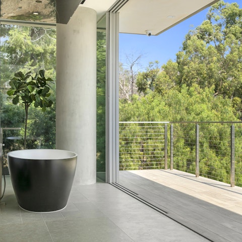 Soak in a tub with a view in the master ensuite