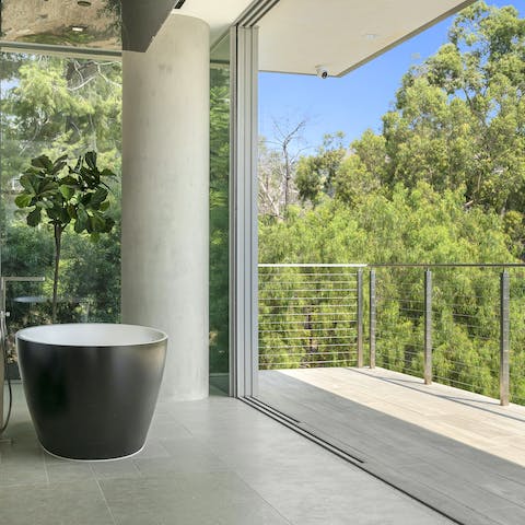 Soak in a tub with a view in the master ensuite