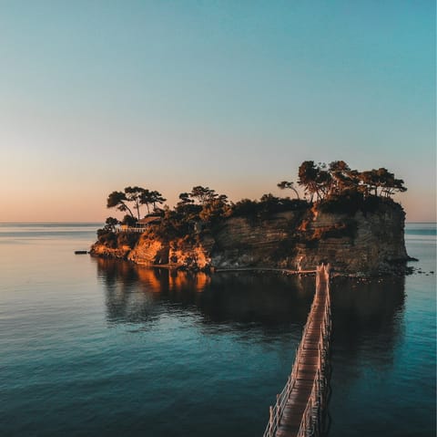 Visit the majestic Cameo Island, a short drive followed by a walk along the water-grazing bridge