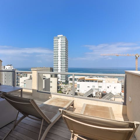 Lay down on one of the sun beds and feel the rays of the sun as you admire the view