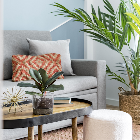 Kick back in the plant-filled living room with a glass of Spanish wine after a day of sightseeing