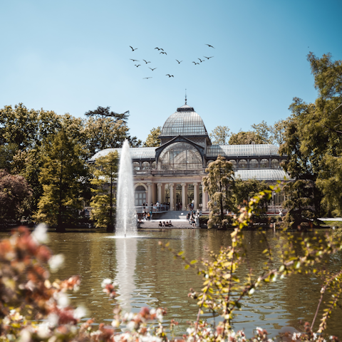 Head to El Retiro Park for a sunny afternoon stroll, just under thirty minutes away on foot or by Metro