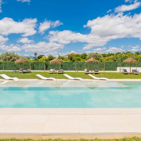 Cool off in the pool with its built-in bubble bench and mountain views