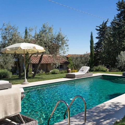 Relax by the pool in the Tuscan sun