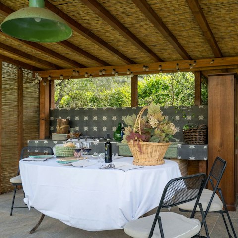 Enjoy an alfresco moment in the shaded outdoor dining area