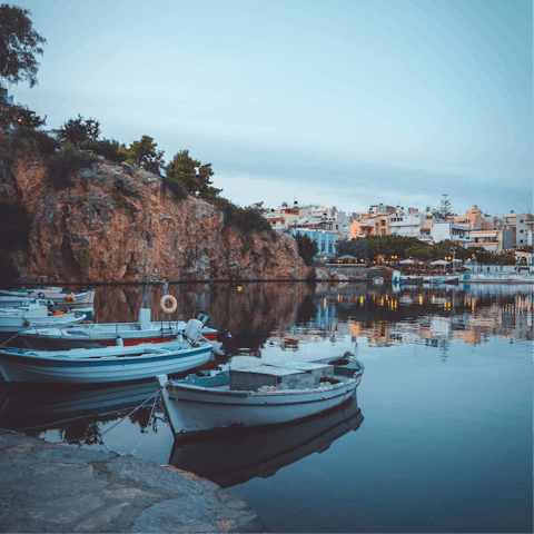 Drive ten minutes to Agios Nikolaos and stroll around the harbour