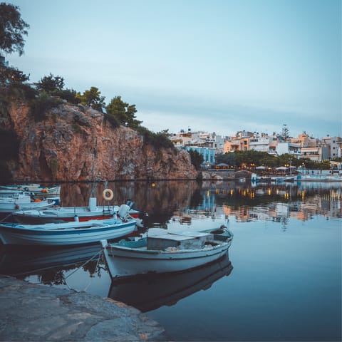 Drive ten minutes to Agios Nikolaos and stroll around the harbour