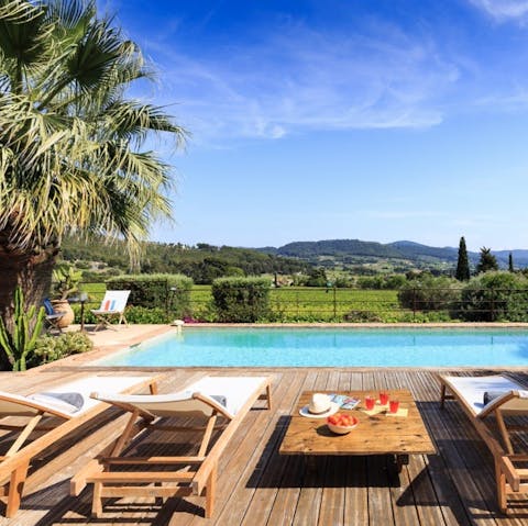 Sprawl out by the pool with a cocktail in hand