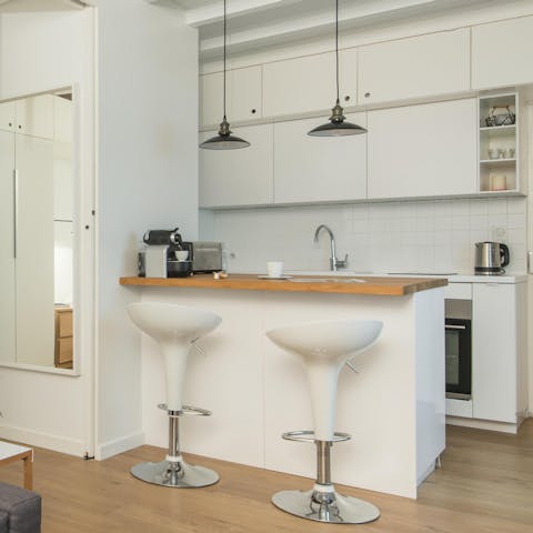 Start mornings with fresh coffee and croissants at the sleek breakfast bar