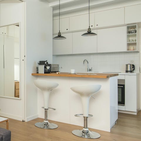 Start mornings with fresh coffee and croissants at the sleek breakfast bar