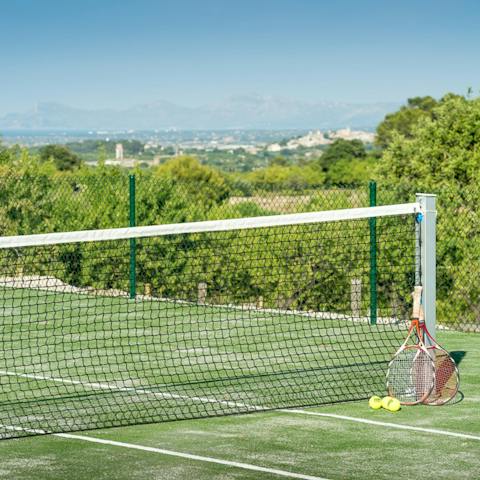 Enjoy a few games of tennis while enjoying great views on the shared tennis court
