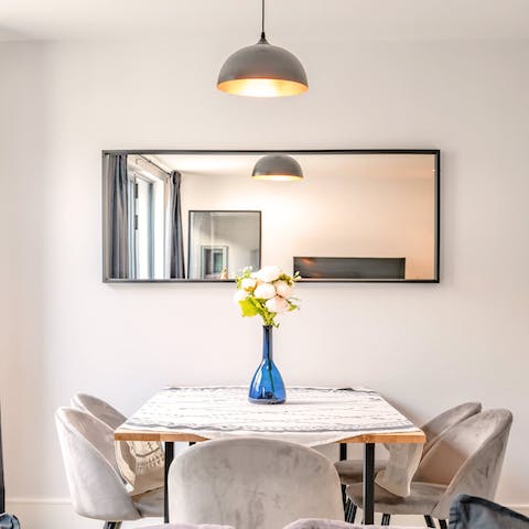 Share a meal or a bottle of wine around the stylish dining table
