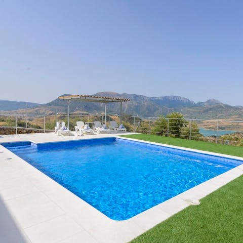 While away sunny afternoons in the shimmering private pool