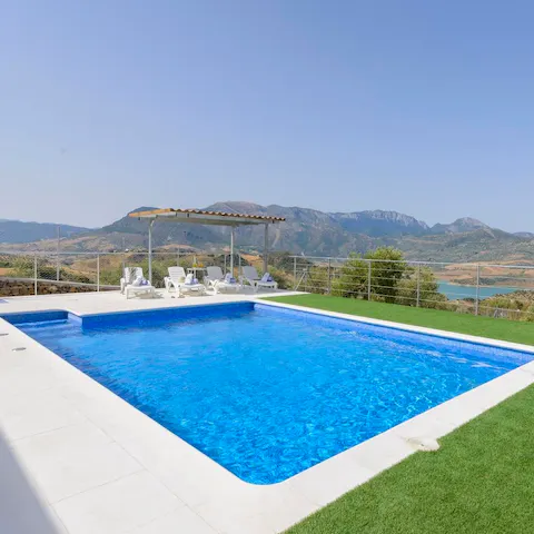 While away sunny afternoons in the shimmering private pool