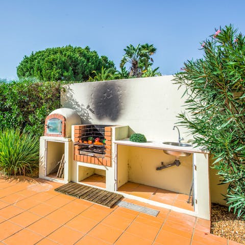 Grill up a delicious alfresco meal in the barbecue area