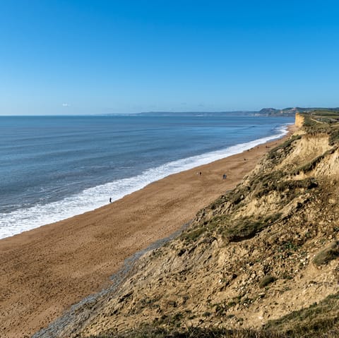 Enjoy a stroll along the sands of Cogden Beach, a short drive away