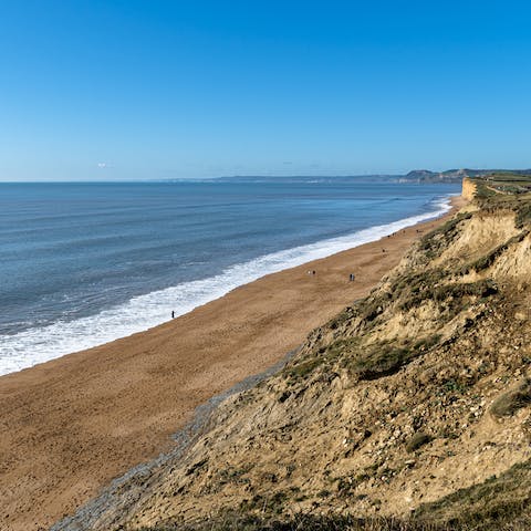 Enjoy a stroll along the sands of Cogden Beach, a short drive away
