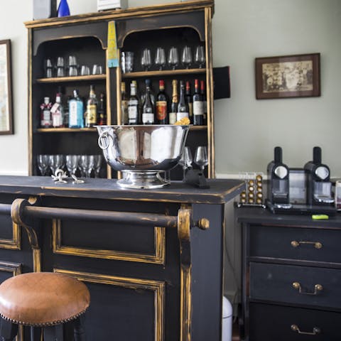 Enjoy a tipple of regional wine or spirits at the antique bar